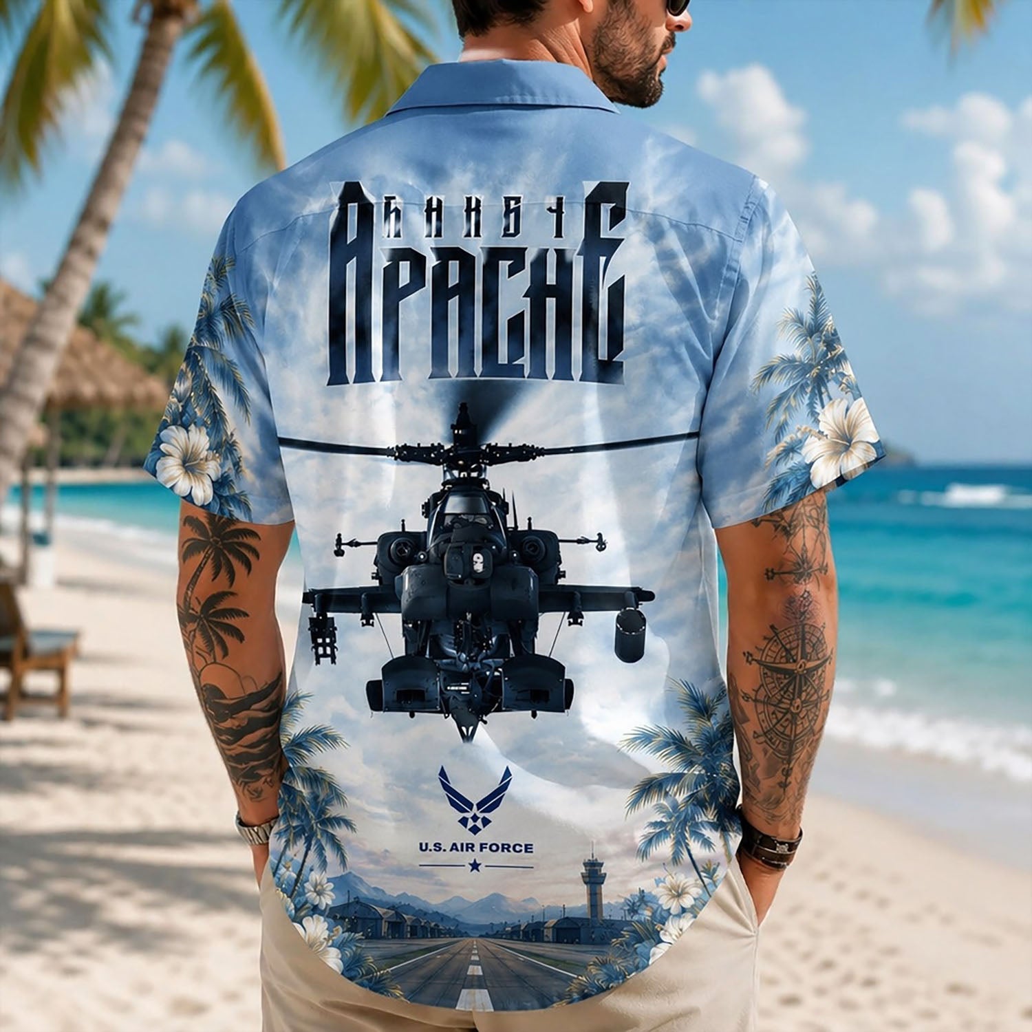 Back view lifestyle of a male model highlighting the military airbase hangar bay scenery, tactical helicopter graphics, and beach shoreline layout