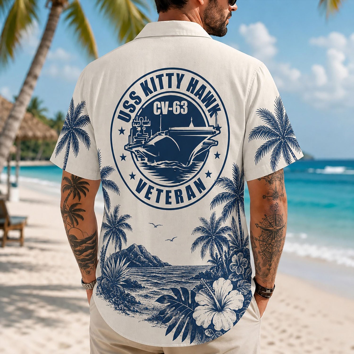Back view lifestyle of a man showing the striking blue circular USS Kitty Hawk CV-63 Veteran commemorative insignia